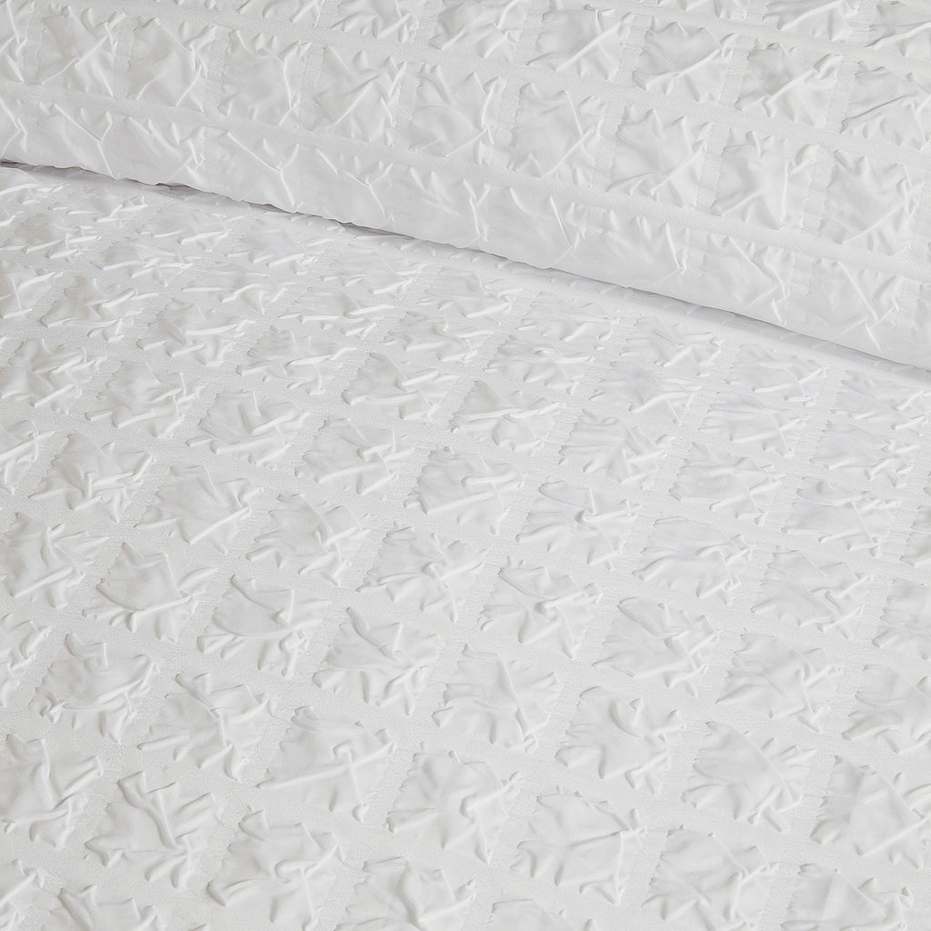 Parure de lit à carreaux en relief blanche