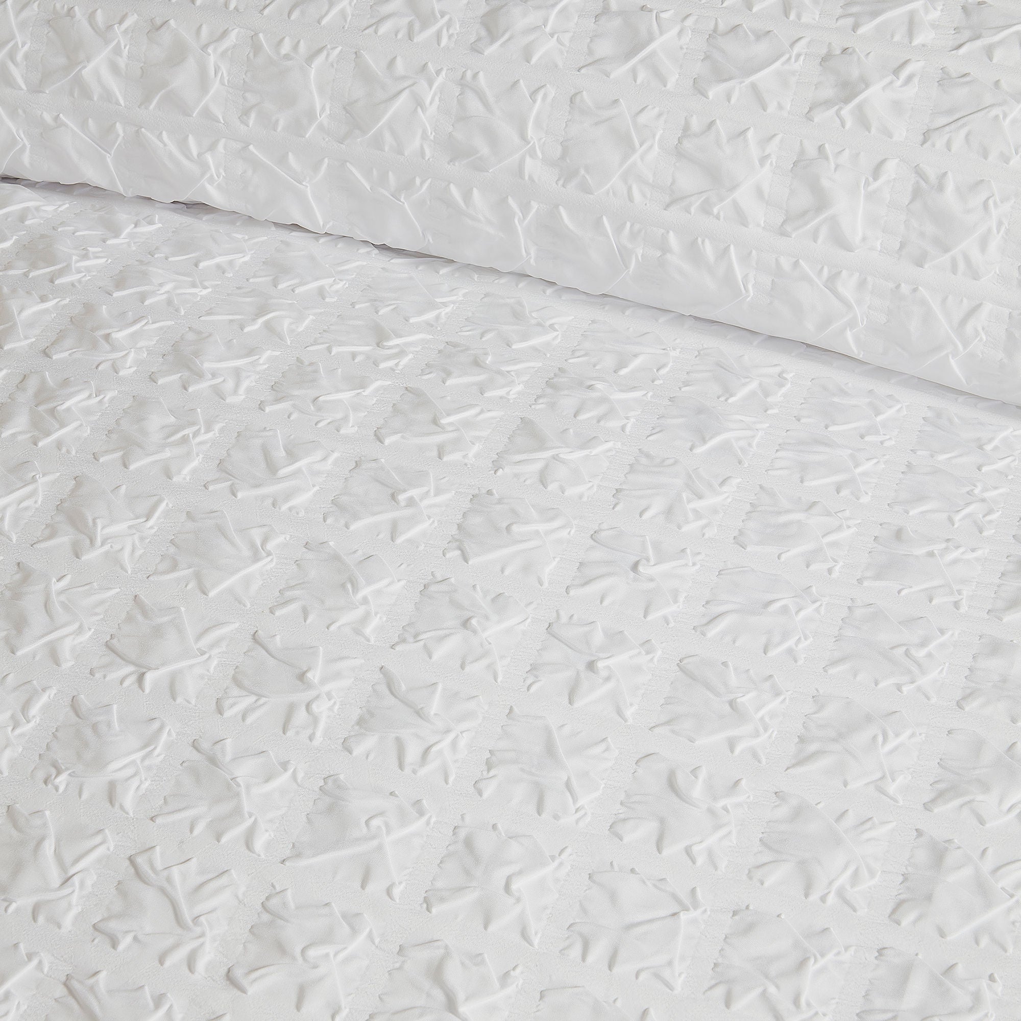 Parure de lit à carreaux en relief blanche